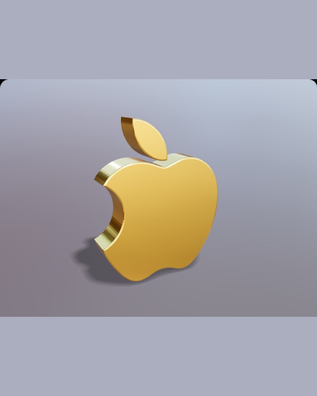 Gold apple-shaped emblem showing its thickness and reflective edge